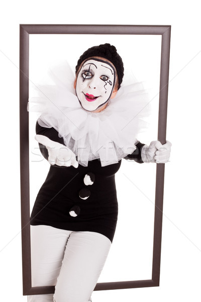 female clown in a frame reaching hand to viewer Stock photo © Pasiphae