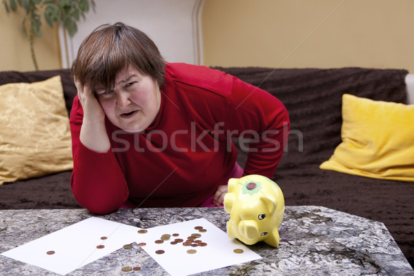 Disabled woman look desperate in front of her bills Stock photo © Pasiphae