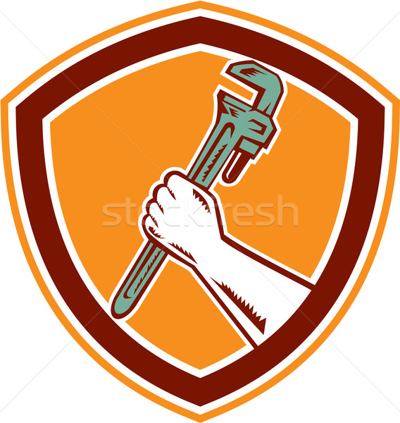 Hand Holding Adjustable Wrench Shield Woodcut Stock photo © patrimonio
