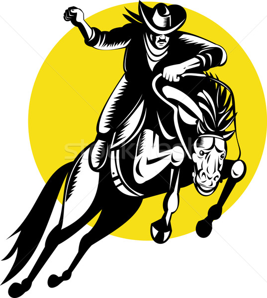 rodeo cowboy riding a bucking bronco Stock photo © patrimonio