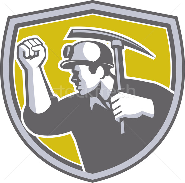 Stock photo: Coal Miner Clenched Fist Pick Axe Shield Retro