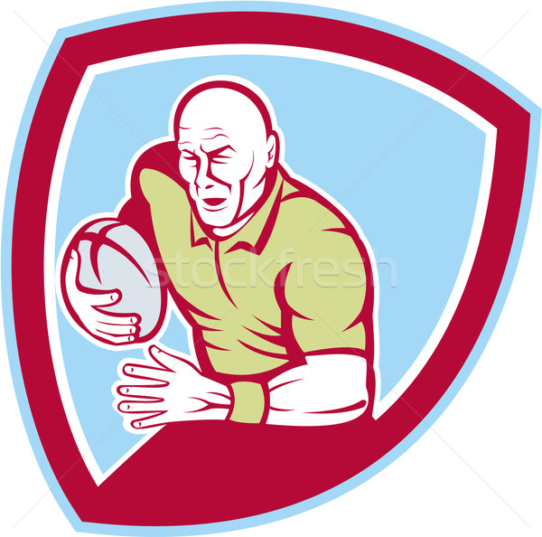 Rugby Player Running Charging Shield Cartoon Stock photo © patrimonio