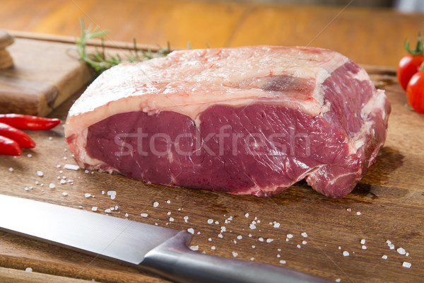 Organic Red Raw Steak Sirloin on wooden board Stock photo © paulovilela