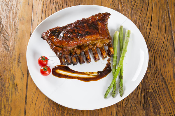 Stock photo: Tasty grilled ribs with vegetables 