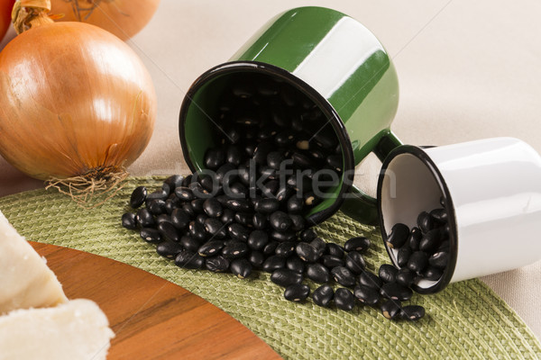 Black beans on wooden background Stock photo © paulovilela