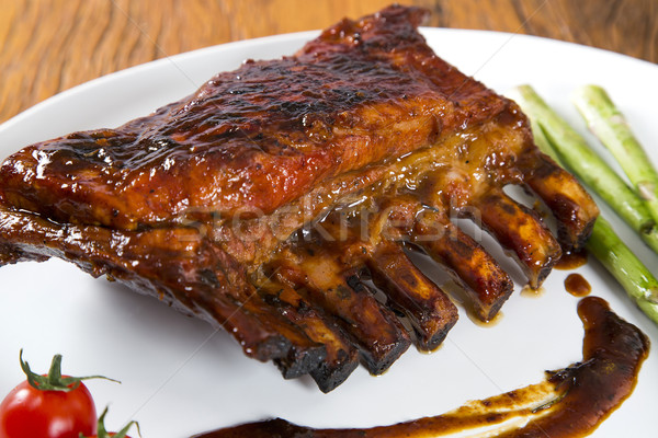 Stock photo: Tasty grilled ribs with vegetables 