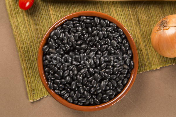 Black beans on wooden background Stock photo © paulovilela