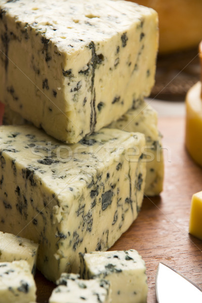 Different cheeses on a cutting board. Stock photo © paulovilela