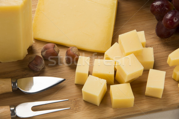 Parmesan planche à découper délicieux alimentaire fond bleu [[stock_photo]] © paulovilela