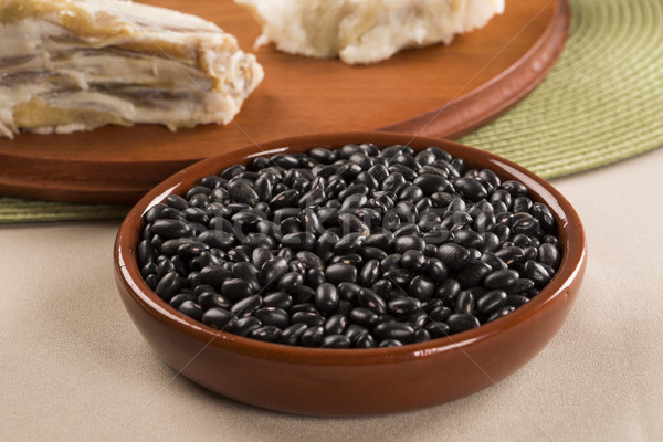 Black beans on wooden background Stock photo © paulovilela