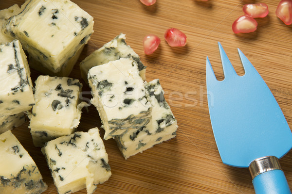 Blue cheese on wooden background. Stock photo © paulovilela