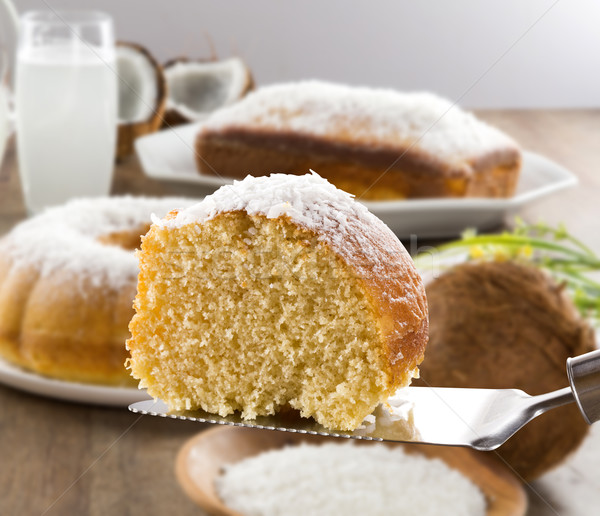 coconut cake with slice on the table Stock photo © paulovilela