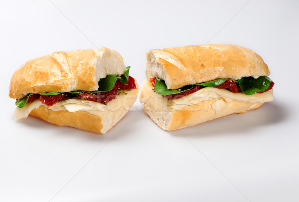 Sandwich on a white plate with turkey breast, tomato, lettuce an Stock photo © paulovilela