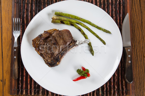 Gegrilltes Fleisch Rippen weiß Platte Tomaten Schnittlauch Stock foto © paulovilela