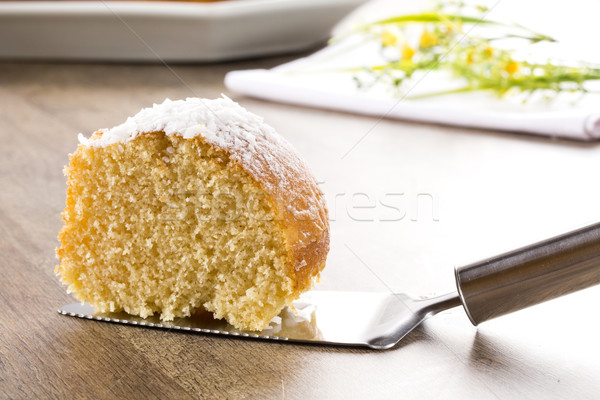 coconut cake with slice on the table Stock photo © paulovilela