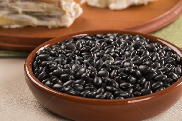 Black beans on wooden background Stock photo © paulovilela