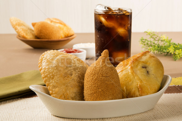 Mixed Brazilian deep fried chicken snack,, esfihas and pastry. Stock photo © paulovilela