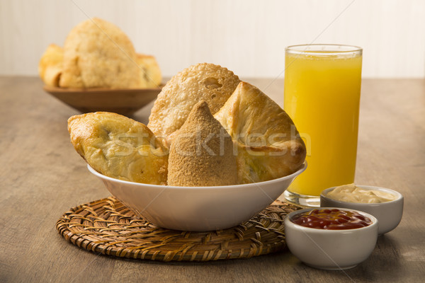 Mixed Brazilian deep fried chicken snack,, esfihas and pastry. Stock photo © paulovilela