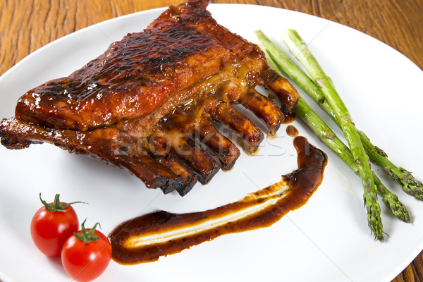 Tasty grilled ribs with vegetables  Stock photo © paulovilela