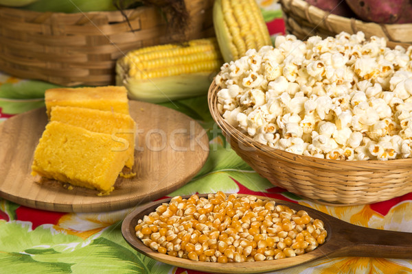 Stock photo: Ear of corn, revealing yellow kernels