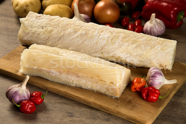 salted codfish on the wooden table with ingredients Stock photo © paulovilela