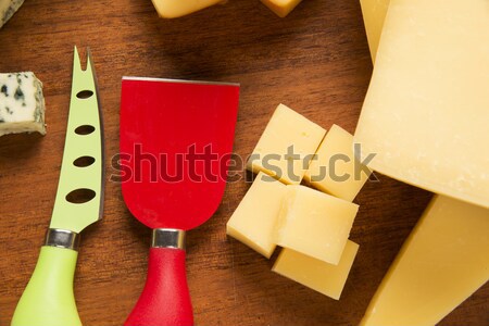 Parmesan planche à découper délicieux alimentaire fond bleu [[stock_photo]] © paulovilela