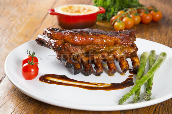 Tasty grilled ribs with vegetables  Stock photo © paulovilela