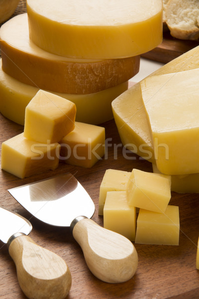 Different cheeses on a cutting board. Stock photo © paulovilela