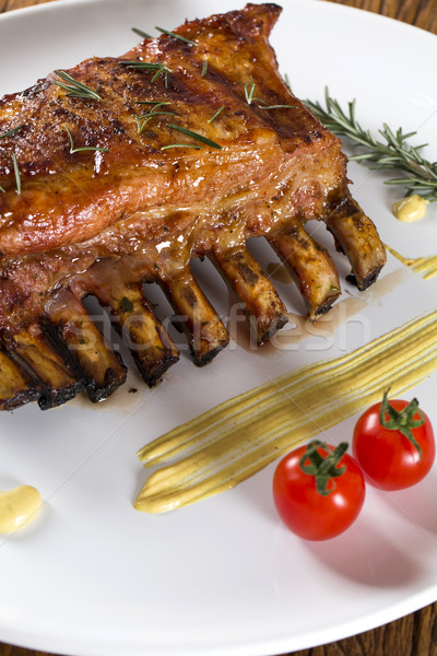 Tasty grilled ribs with vegetables  Stock photo © paulovilela