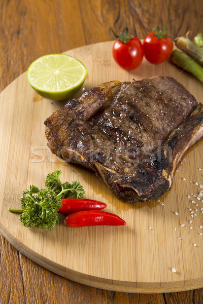 Mięso z grilla biały tablicy pomidory szczypiorek Zdjęcia stock © paulovilela