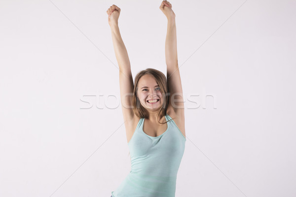 happy woman with her hands up Stock photo © Pavlyuk