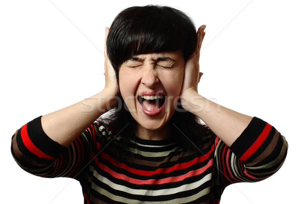 Beautiful woman stops her ears and screaming Stock photo © pekour