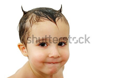 Little boy with horns made out of wet hair Stock photo © pekour