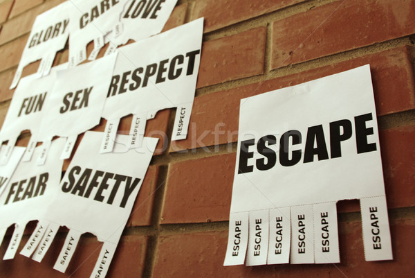 Tear-off Escape ad on the bulletin wall Stock photo © pekour