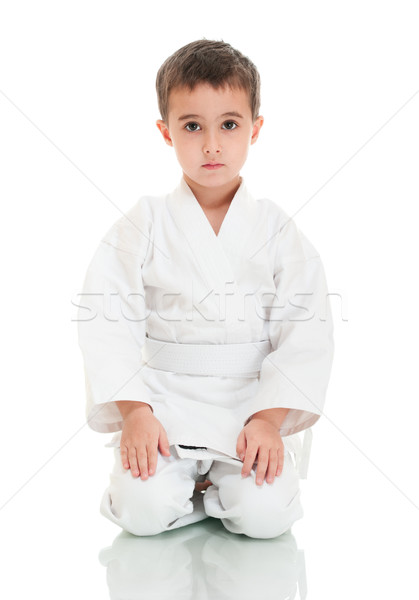 Karate fiú ül fehér kimonó izolált Stock fotó © pekour