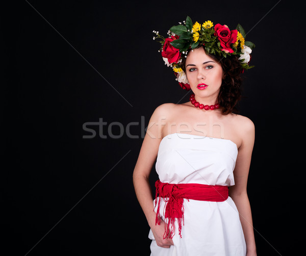 Beautiful woman in flower wreath, white dress and red sash Stock photo © pekour