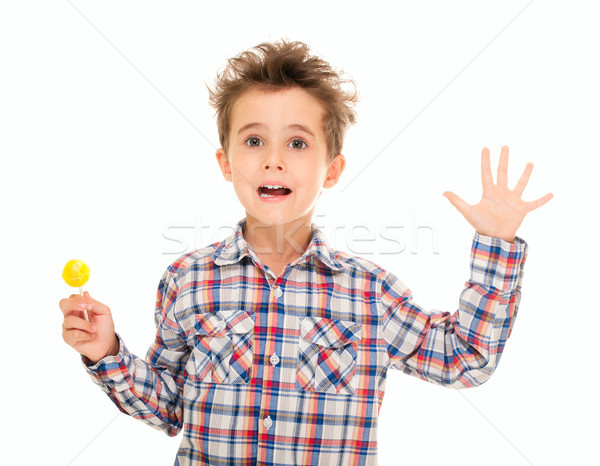 Little boy wave goodye with lollypop in hand Stock photo © pekour