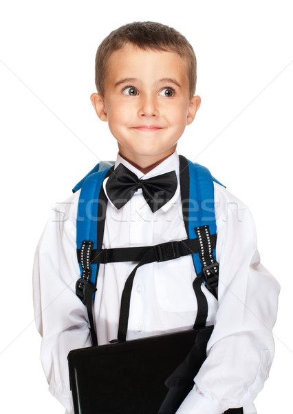 Little boy elementary student with laptop, backpack and bowtie Stock photo © pekour