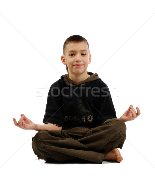Peaceful boy in yoga pose Stock photo © pekour