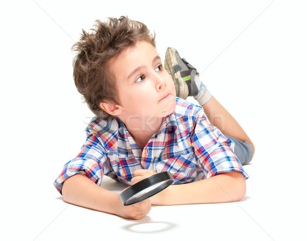 Pensive little boy with weird hair and magnifier Stock photo © pekour