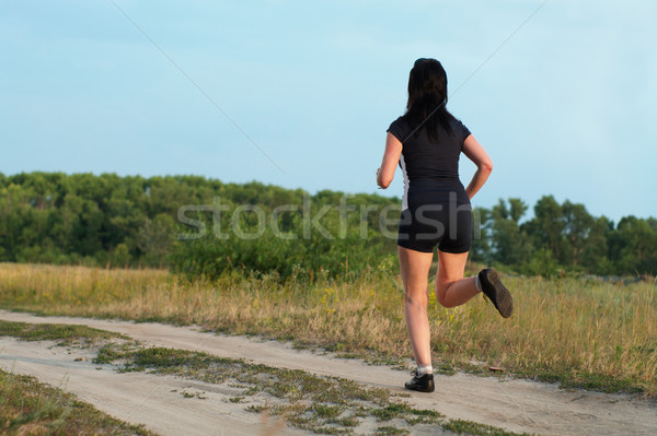 Mulher corrida ao ar livre prado verão estrada Foto stock © pekour