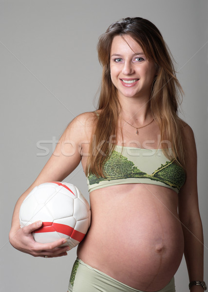 Mulher grávida posando feliz futebol estúdio esportes Foto stock © pekour