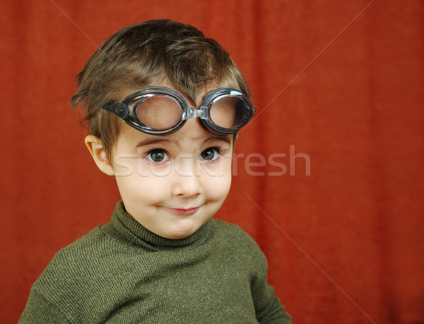 Small boy in swimming glasses plays a pilot Stock photo © pekour