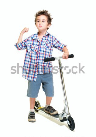 Naughty hairy little boy in shorts and shirt with scooter Stock photo © pekour