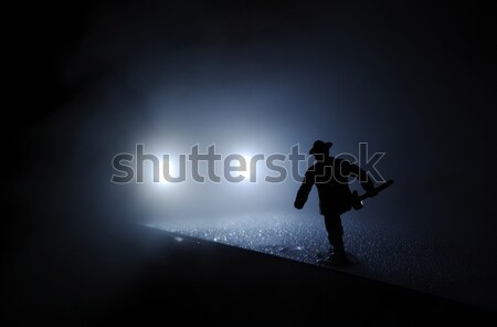 Firefighter run onto the car lights in the mist  Stock photo © pekour