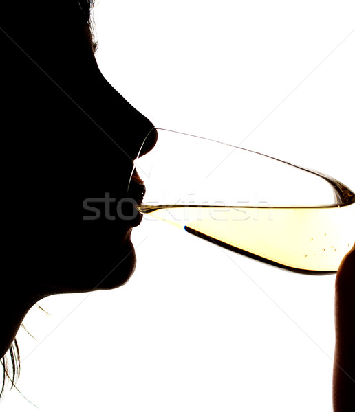 Silhouette of the girl drinking sparkling wine Stock photo © pekour