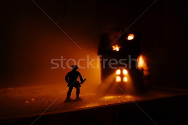 Firefighter run onto the burning house Stock photo © pekour
