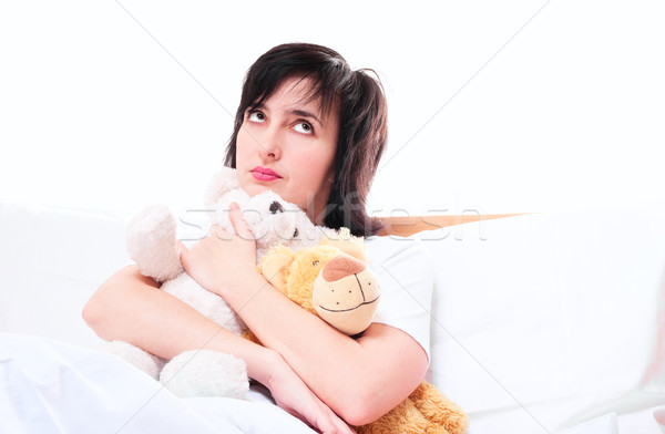 Сток-фото: женщину · кровать · мишка · игрушками · изолированный