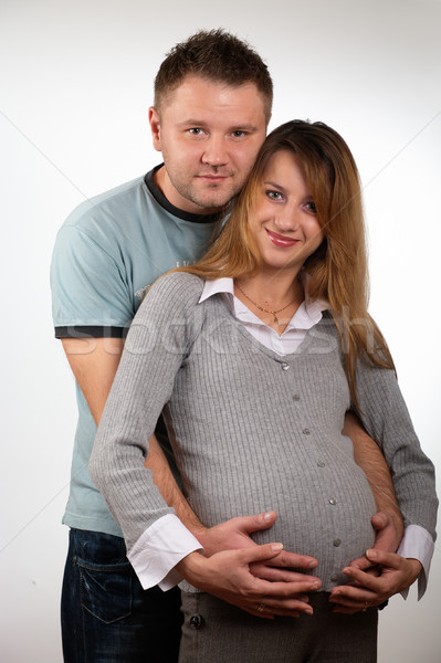 [[stock_photo]]: Heureux · enceintes · couple · studio · femme · sourire