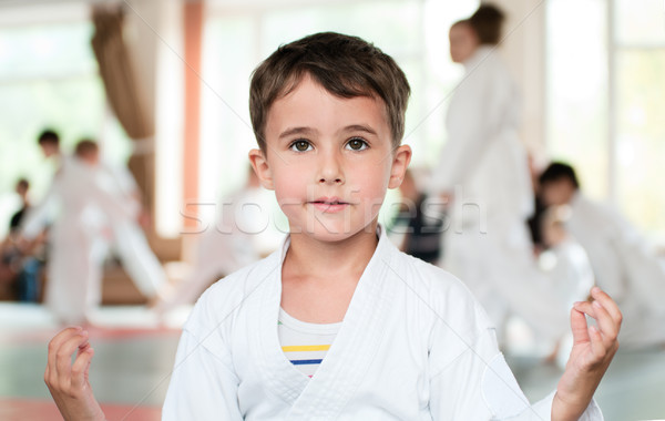 Pequeno menino quimono meditação competição aikido Foto stock © pekour